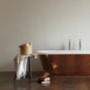 The Copper Tay cast iron skirted bath tub