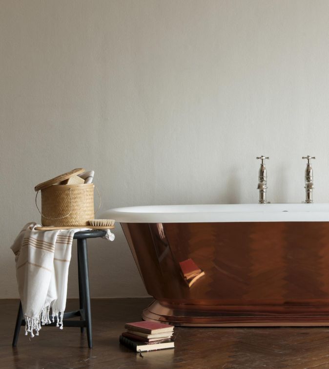 The Copper Tay cast iron skirted bath tub