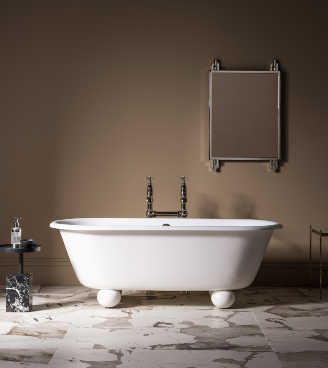 The Newton Cast Iron Bath Tub With Ball Feet has generous rounded proportions and unique ball feet for a timeless contemporary silhouette. Appearing to float ethereally, the design juxtaposes its traditional cast-iron construction.